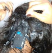 Mulher tenta entrar em presídio com celular amarrado no cabelo