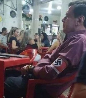 Homem que exibiu símbolo nazista em bar de MG será investigado