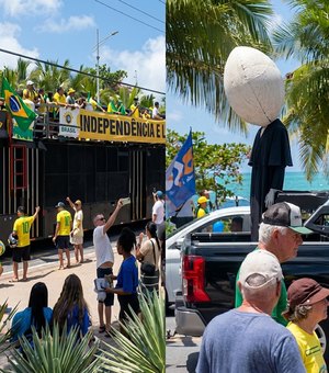 Manifestantes levam boneco com cabeça de ovo para protesto na orla de Maceió