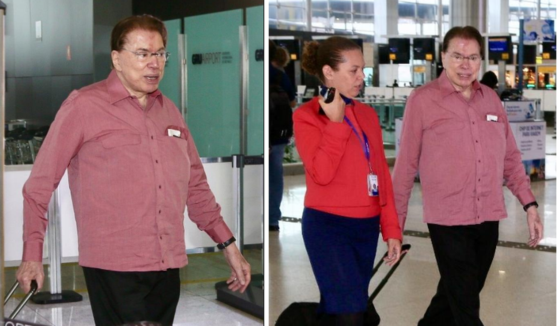 Abatido, Silvio Santos é visto deixando o Brasil ao lado da mulher