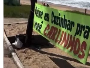 Mulher acampa em frente a casa de Carlinhos Maia em Maceió e estende faixa pedindo para cozinhar para ele