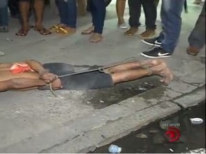 Assaltante é amarrado por populares na Praça Centenário