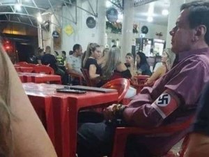 Homem que exibiu símbolo nazista em bar de MG será investigado