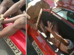 Travesti é vista amarrada dentro de porta malas e sendo agredida diante de Guardas Municipais