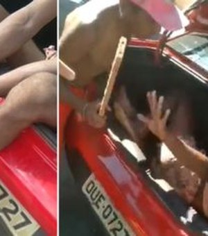 Travesti é vista amarrada dentro de porta malas e sendo agredida diante de Guardas Municipais