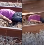 Homem deita em trilho e trem passa por cima dele em trend viral