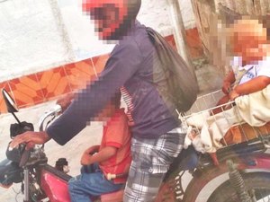 SMTT flagra homem conduzindo criança amarrada a motocicleta 